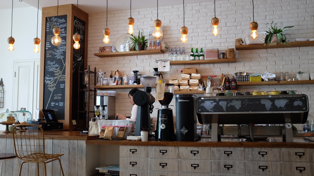Warm vintage coffee shop interior with espresso cups on a wooden counter, suggesting films set in coffee shops.