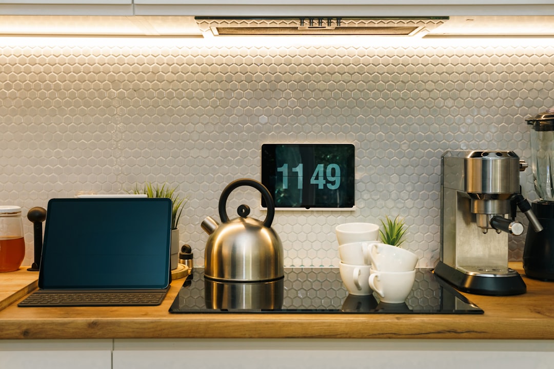 Automatic drip coffee maker on a kitchen counter with a fresh cup, for best drip coffee makers.