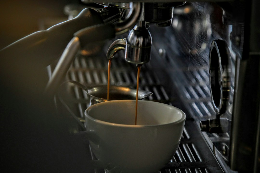 Espresso pouring from a machine, representing the best espresso machines under $1,000.