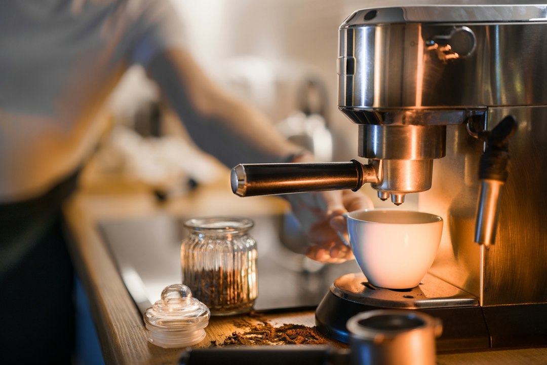 Espresso cup and machine illustrating the Fellow Ode Gen 2 grinder review.