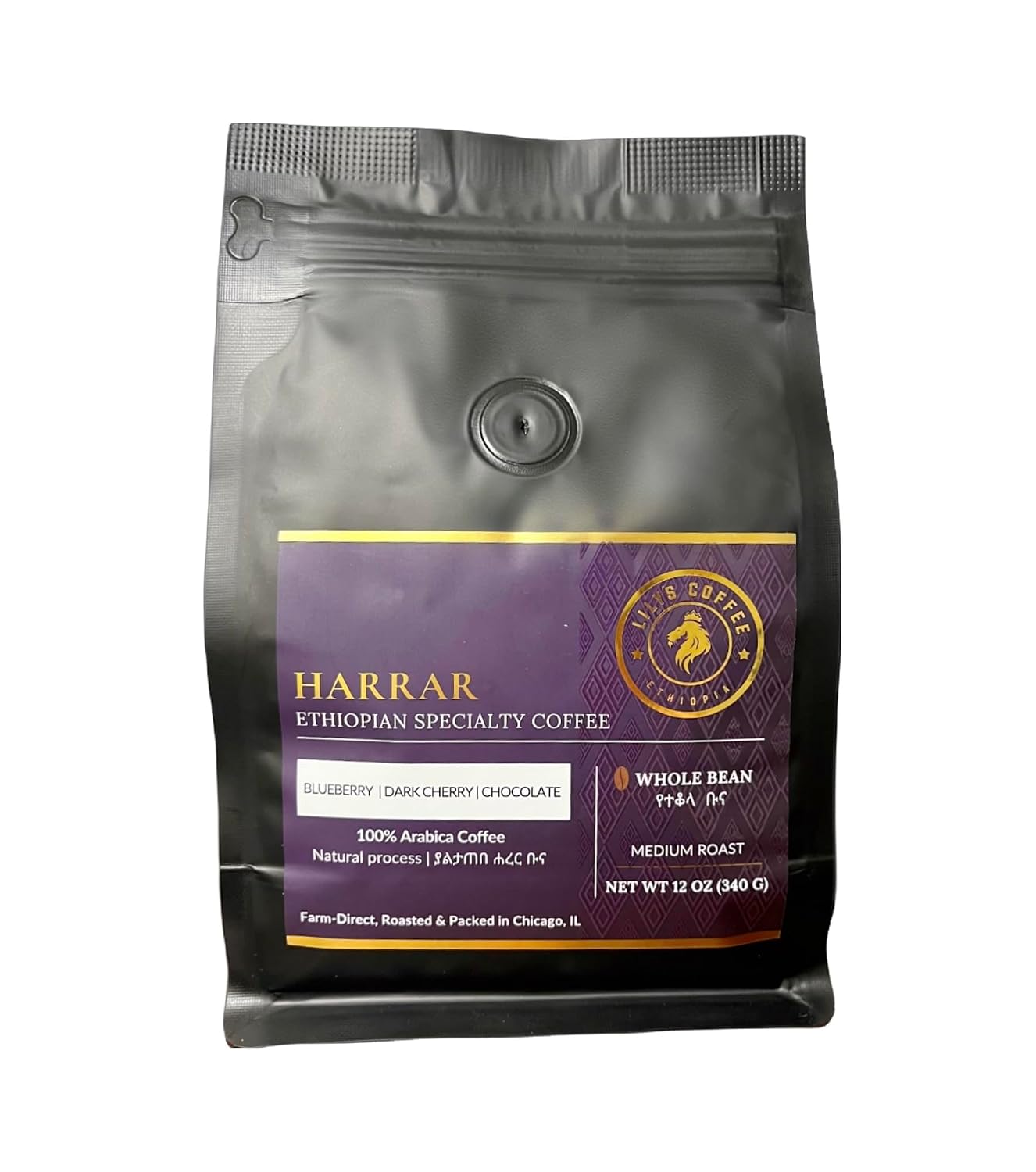 A tall glass of iced cold brew coffee with a swirl of cream beside berries, coffee beans, and mint on a sunny patio table, a refreshing summer setting for Ethiopian Harrar coffee.