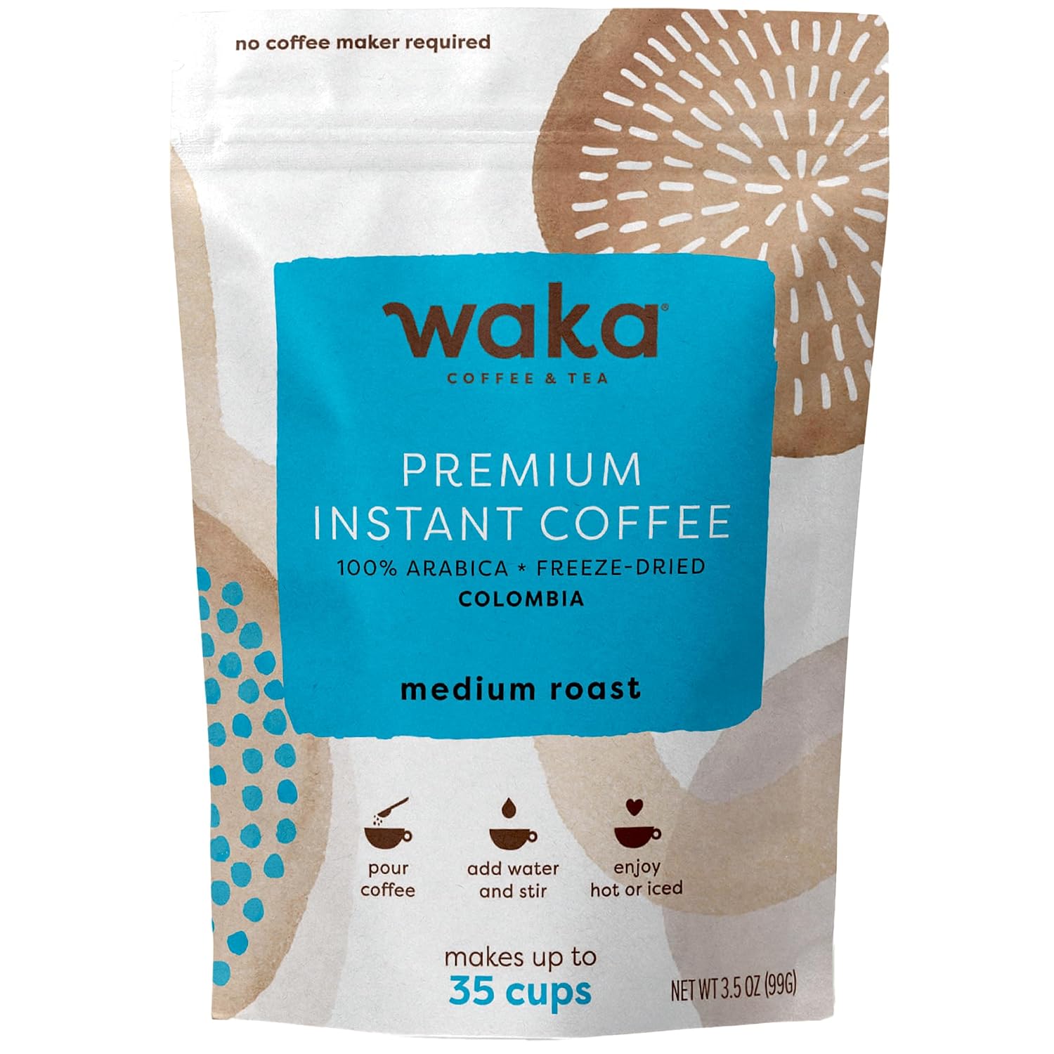 Iced instant coffee with milk in a tall glass beside a jar of freeze-dried instant coffee granules, a heaped teaspoon, cinnamon and cacao powder.